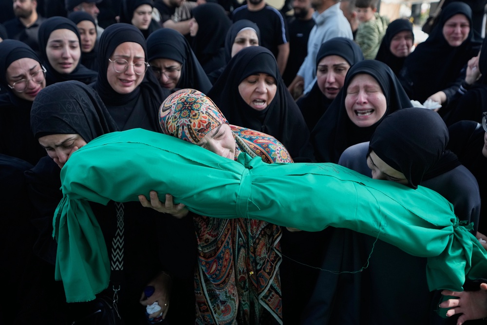 Women grieve as they carry the body of 6-month-old Mariam Fahos during a funeral procession for people killed a day earlier in an Israeli airstrike in the village of Saksakieh, in the southern port city of Sidon, Lebanon, Sunday (Copyright 2026 The Associated Press. All rights reserved)