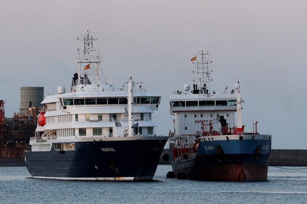 A tanker floats next to the MV Hondius, affected by a hantavirus outbreak, at the port of Granadilla de Abona in Tenerife, Spain (Reuters)