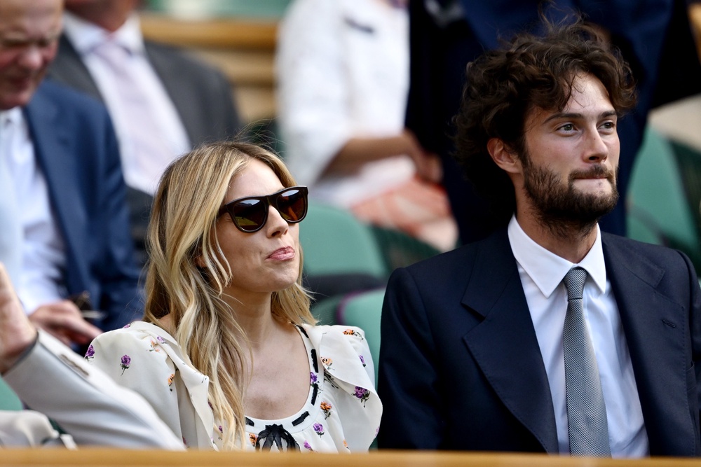 Miller now has two children with Oli Green (right), in addition to another child from a previous relationship (Getty)