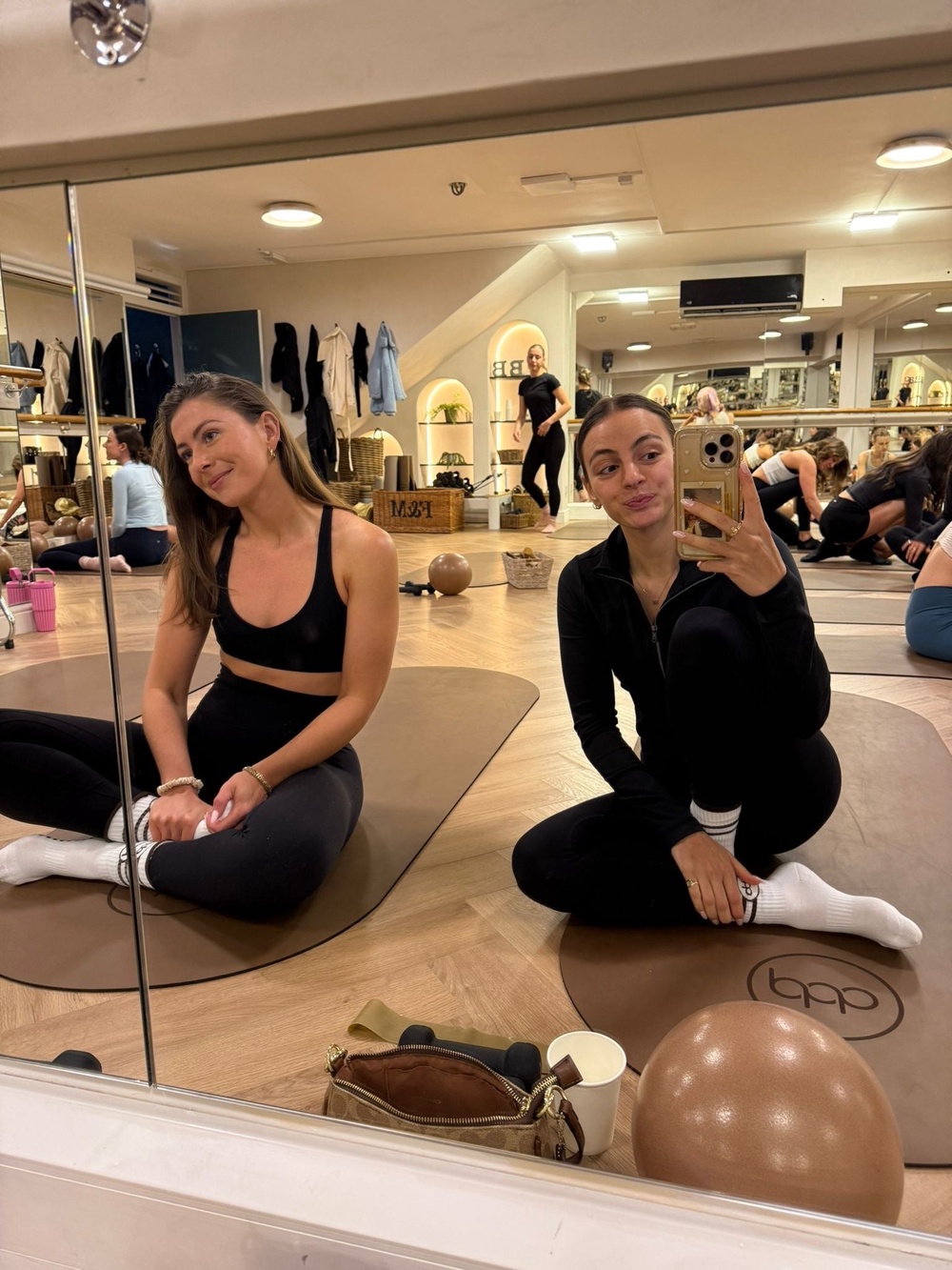 Mood booster: Lydia and her friend Molly in Paola’s studio in Fulham (Lydia Spencer-Elliott/The Independent)
