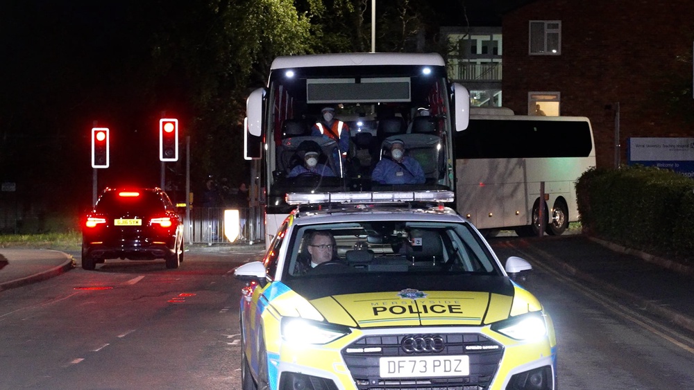 Screen grab from PA Video of coaches arriving at Arrowe Park Hospital on Merseyside (PA) (PA Wire)