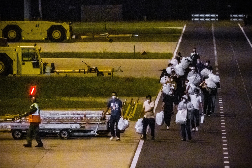 Passengers on a third evacuation flight from Tenerife arrive at Eindhoven Air Base in Eindhoven, Netherlands on 12 May 2026 (AFP/Getty)