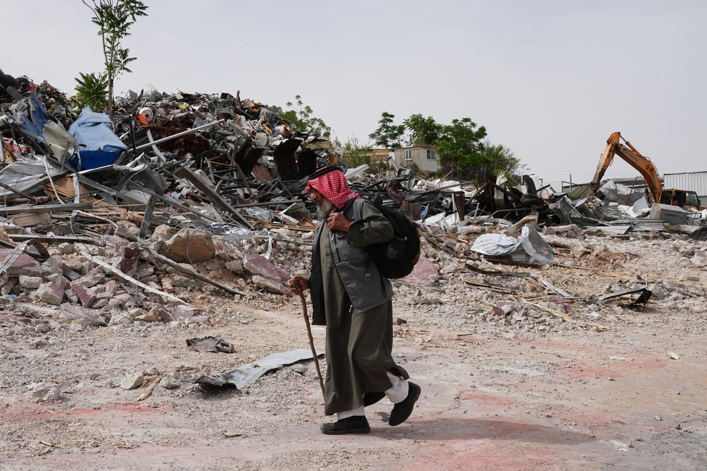 A man inspects the site of an Israeli army demolition campaign that targeted several Palestinian commercial structures overnight, days after the issue of demolition and evacuation orders to owners, in the West Bank town of Al-Eizariya Tuesday, May 12, 2026. (AP Photo/Mahmoud Illean) (Copyright 2026 The Associated Press. All rights reserved)