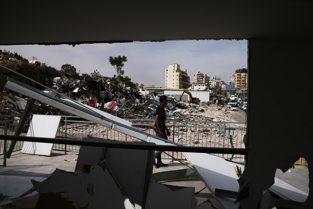 A man inspects the site of an Israeli army demolition campaign that targeted several Palestinian commercial structures overnight, days after the issue of demolition and evacuation orders to owners, in the West Bank town of Al-Eizariya Tuesday, May 12, 2026. (AP Photo/Mahmoud Illean) (Copyright 2026 The Associated Press. All rights reserved)