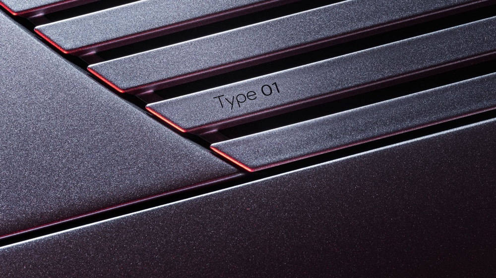 The Jaguar Type 01 name appears on the strikethrough graphic where the car's long bonnet meets the windscreen. (Jaguar)