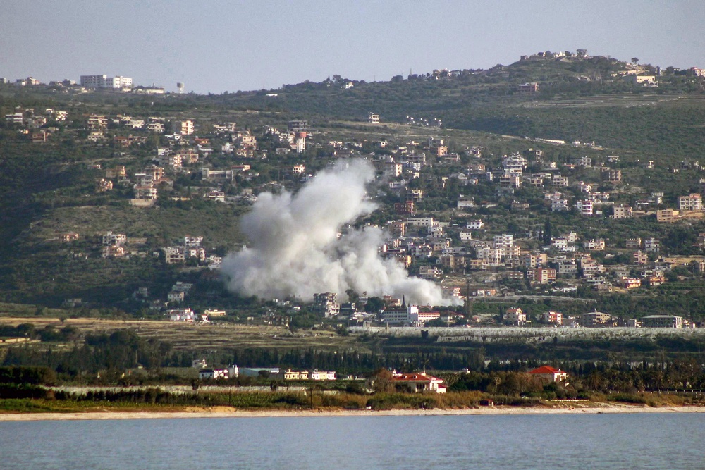 Smoke rises following Israeli bombardment on the village of Mansouri as seen from nearby Tyre in southern Lebanon on May 12, 2026. (AFP/Getty)