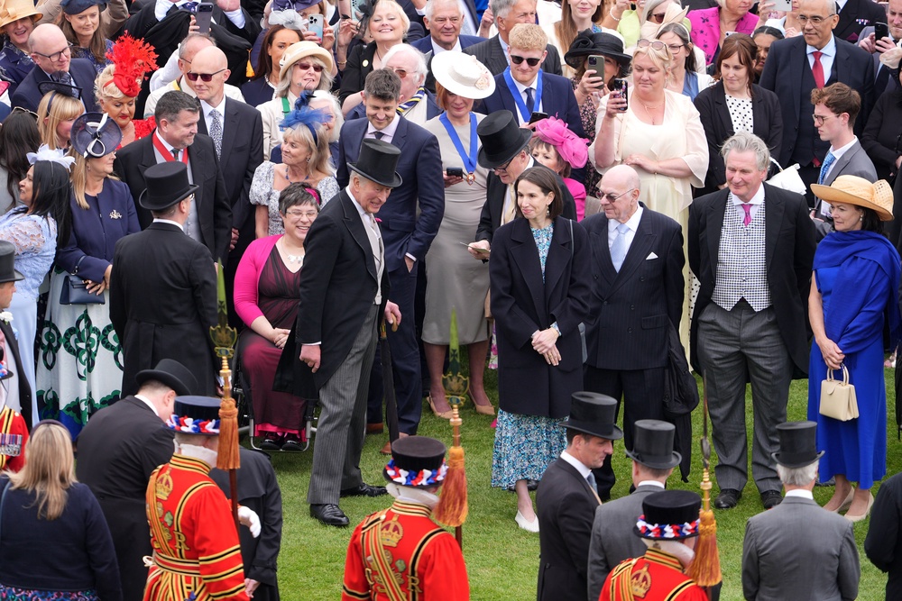 The King greets guests during a garden party at Buckingham Palace to celebrate frontline workers (Yui Mok/PA) (PA Wire)