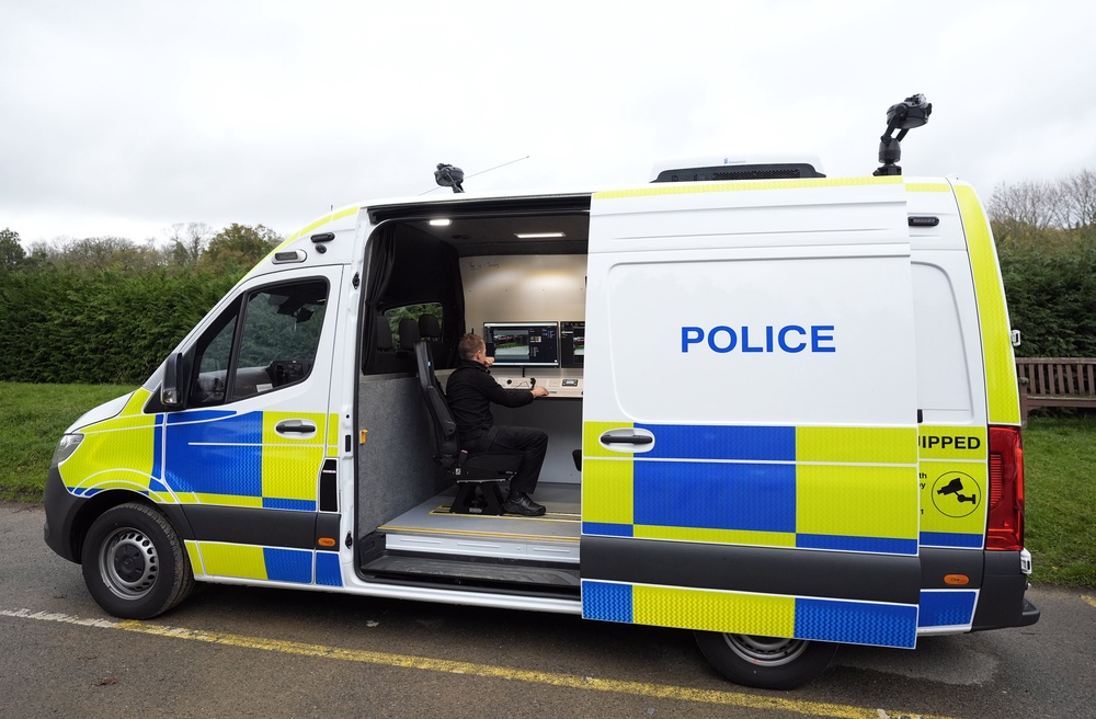 A police officer views a camera feed from inside a live facial recognition (PA) demonstration (PA Wire)