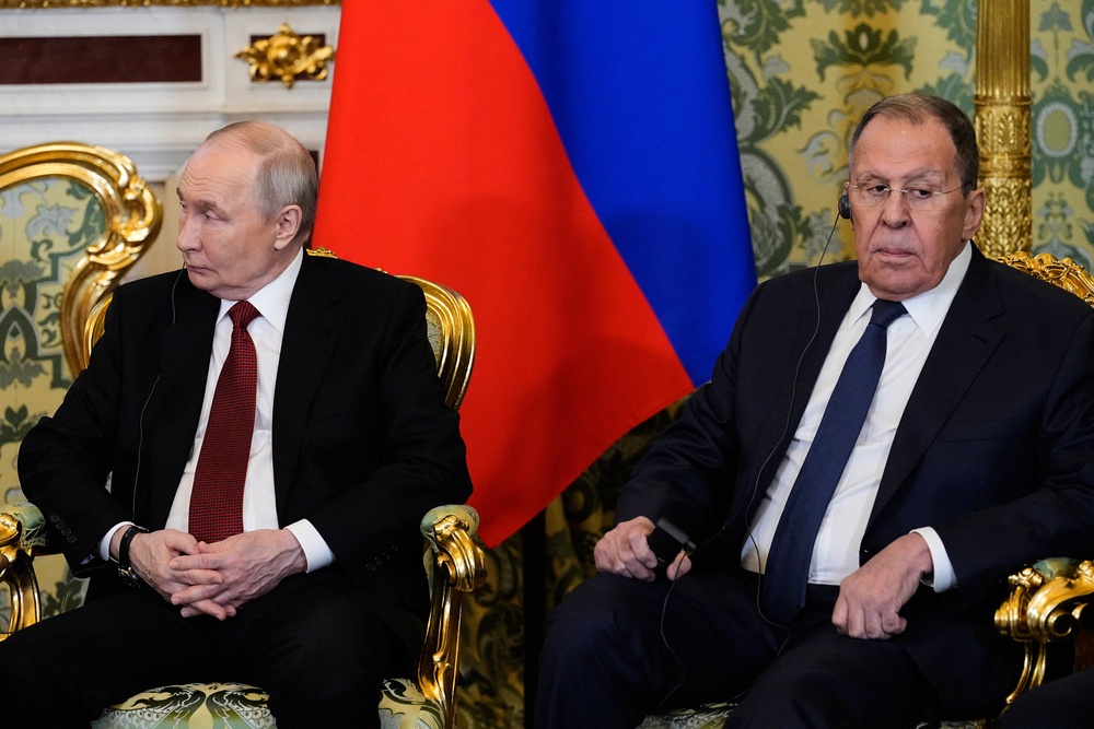 Russia's president Vladimir Putin and Russia's foreign minister Sergei Lavrov attend a meeting in Moscow (AFP/Getty)