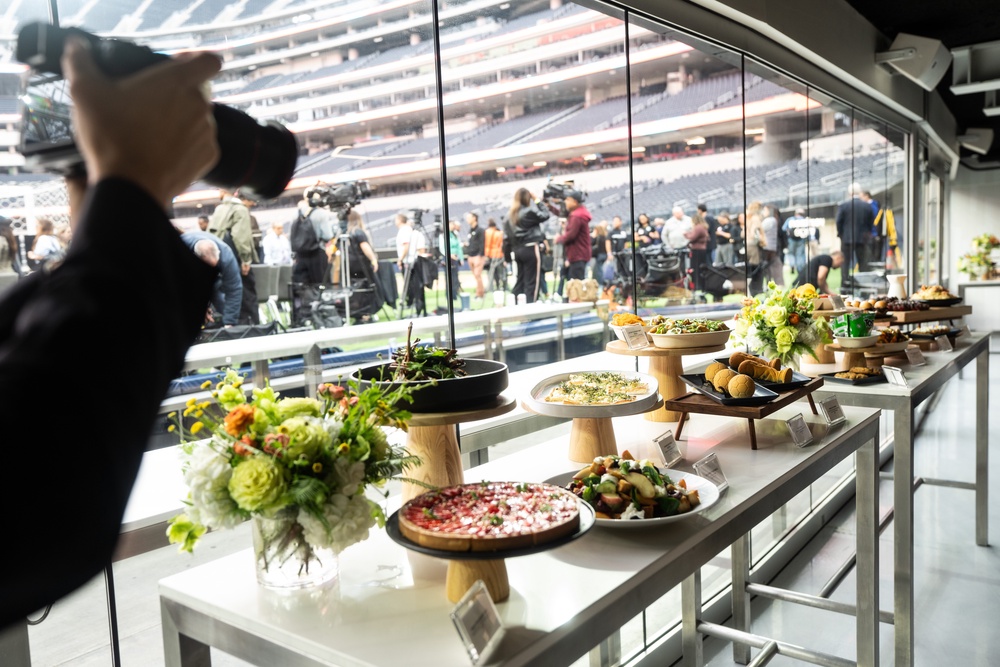 Fans can choose from a variety of food and drink options including salsa verde aguachile with lime marinated shrimp, kettle cooked crispy pickles, stone fruit panzanella, spiced lamb rack, smoked salmon mousse, petite beef burgers, tune poke and aged ribeye cap with bordelaise and mashed potatoes (AP)