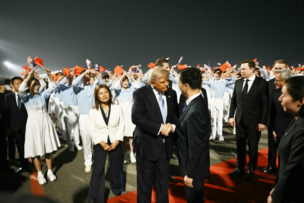 SpaceX, Twitter and electric car maker Tesla CEO Elon Musk looks on as Trump greets China's vice president (AFP/Getty)