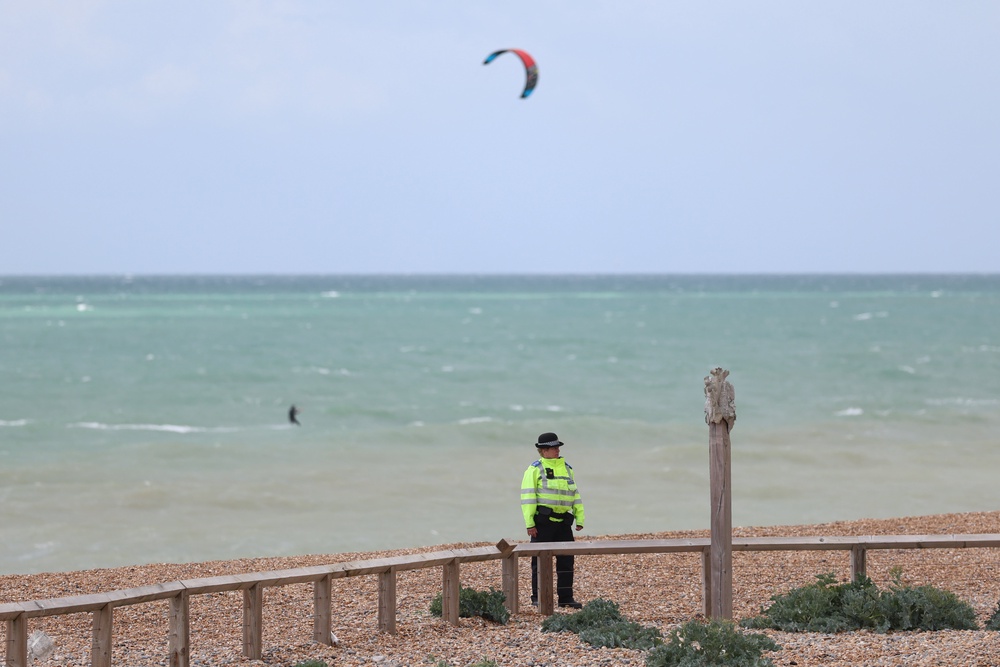 Police guard the beach (Getty)