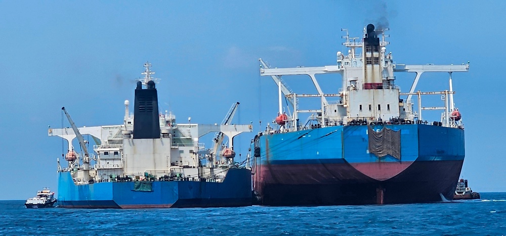 This handout photo from United Against Nuclear Iran shows two oil tankers making a ship-to-ship transfer of Iranian oil (Local Library)