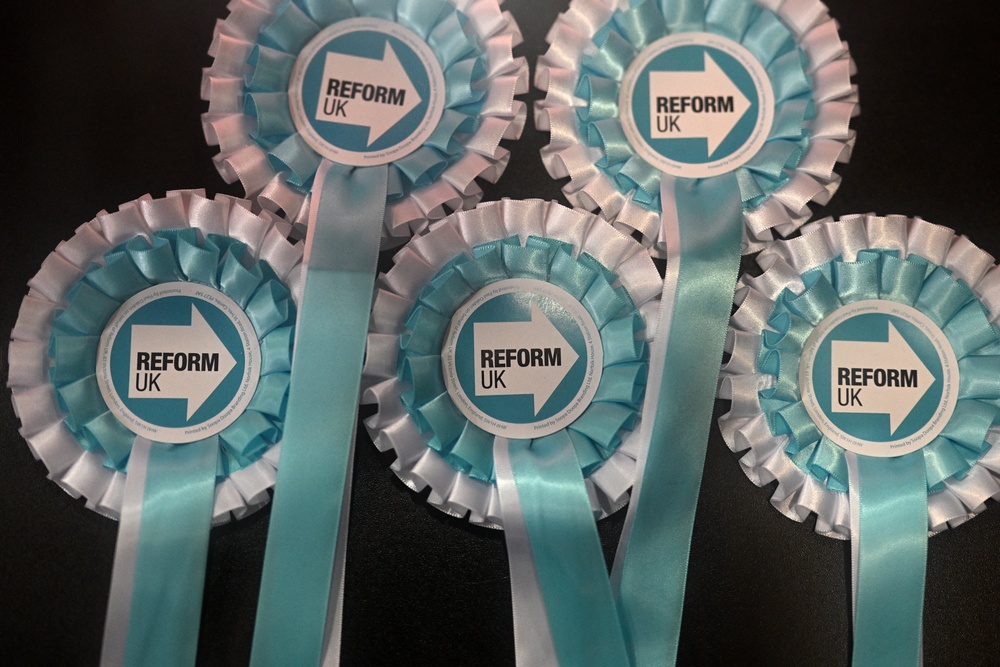Nigel Farage said on Friday that Cllr Cooper was ‘not welcome’ within Reform (AFP/Getty)