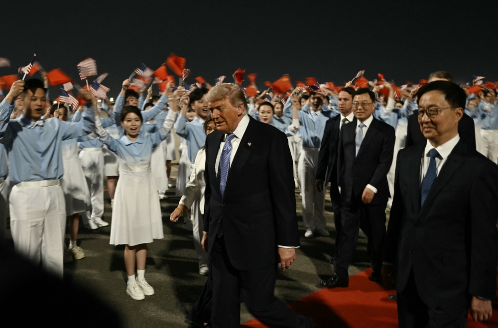 Children waving flags greeted the presidential delegation (AFP/Getty)