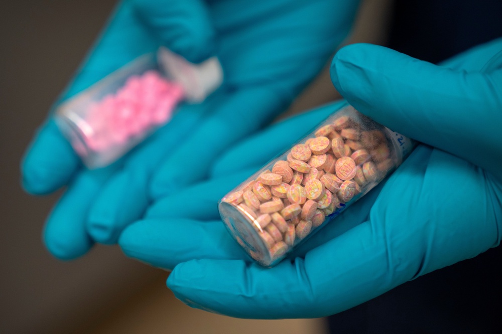 Jonathan Dumke, a senior forensic chemist with the Drug Enforcement Administration, holds vials of fentanyl pills at a DEA research laboratory (Copyright 2025 Associated Press. All rights reserved)