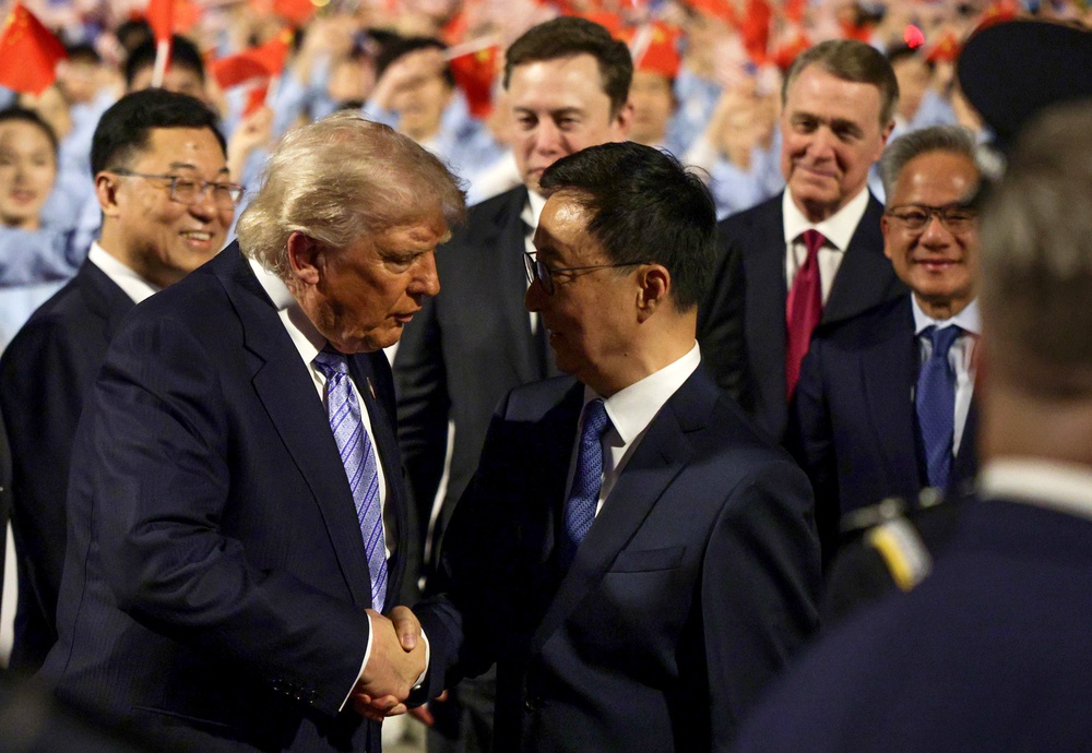 Trump greets Vice President of China Han Zheng as he walks to his motorcade (Getty)