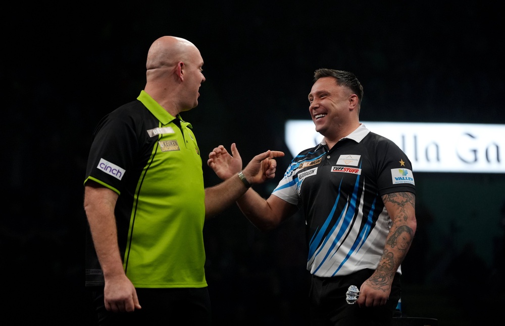 Gerwyn Price (right) takes on Michael van Gerwen in a crunch clash in Birmingham (Bradley Collyer/PA) (PA Archive)