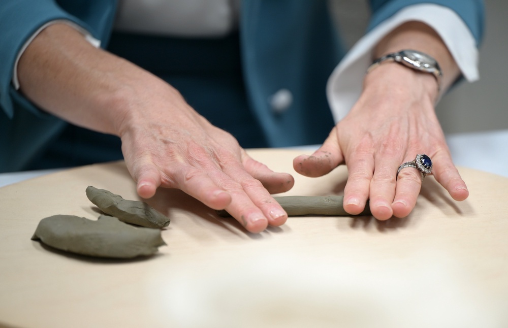 Kate rolled some clay into a long, thin shape (Stuart C Wilson/PA) (PA Wire)