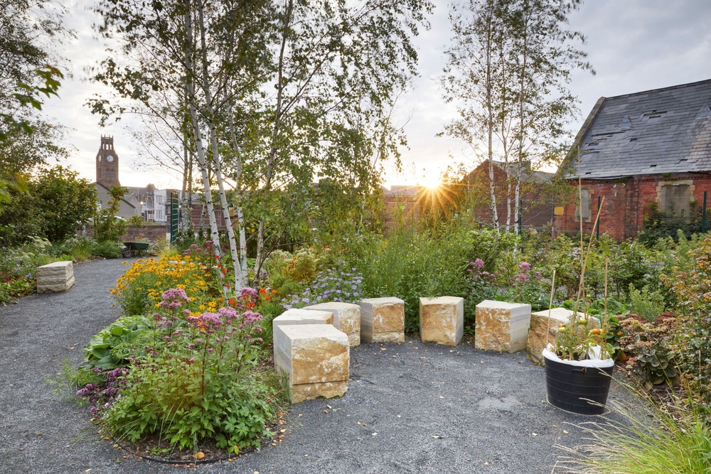 Britt Willoughby of the Mind Garden, designed by Andy Sturgeon, which has transformed a space next to Mind-in-Furness's building in Barrow-in-Furness, Cumbria. (Britt Willoughby/PA Wire)