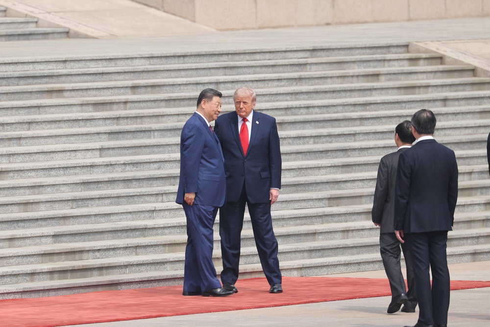 Chinese President Xi Jinping stands with U.S. President Donald Trump during a welcome ceremony at the Great Hall of the People (Reuters)