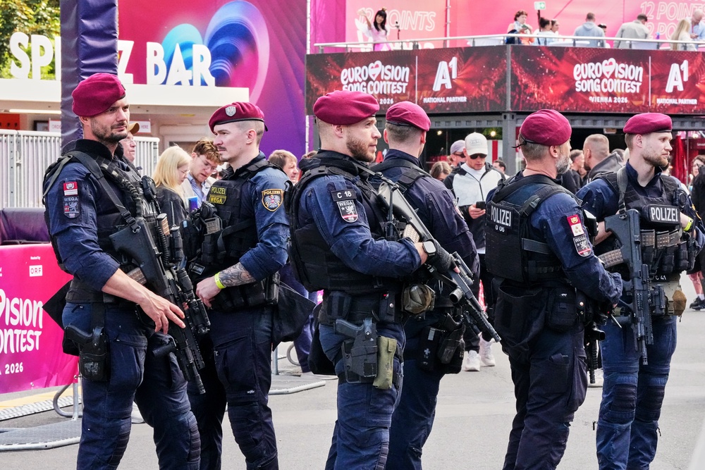 Police patrols with heavy weapons at the Eurovision Village during the 70th Eurovision Song Contest week in Vienna, Austria, Wednesday, May 13, 2026. (AP Photo/Martin Meissner) (Copyright 2026 The Associated Press. All rights reserved.)