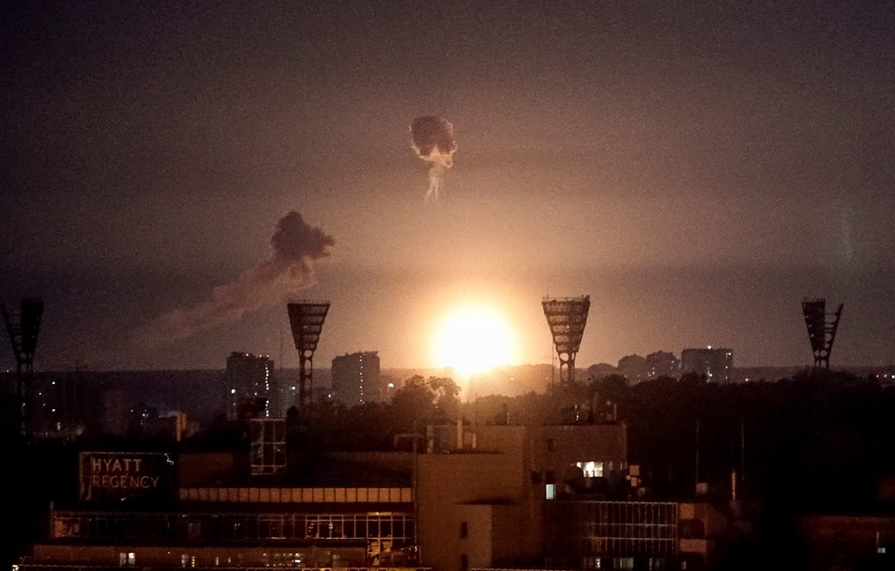 Buildings seen in Kyiv after an explosion lights up the sky over the city during a Russian missile and drone strike (Reuters)