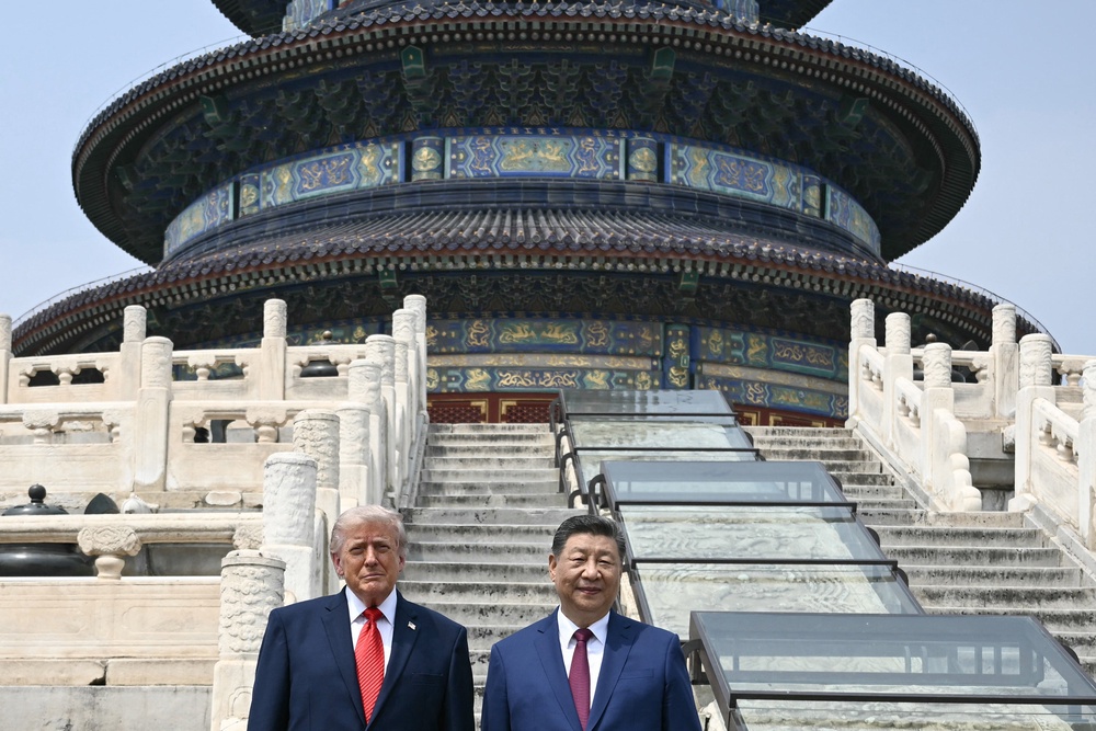 China's President Xi Jinping (R) and US President Donald Trump pose for a photo at the Temple of Heaven in Beijing (AFP/Getty)