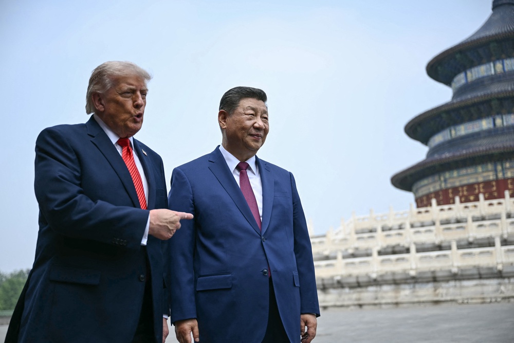 Xi Jinping and Donald Trump visit the Temple of Heaven in Beijing (AFP via Getty)