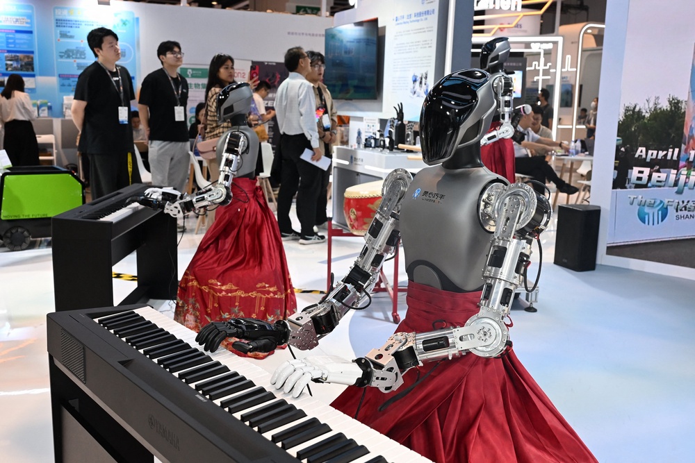 Robots play keyboards at the Hong Kong InnoEx 2026 Robot and AI Fair at the Convention and Exhibition Centre in Hong Kong (AFP via Getty)