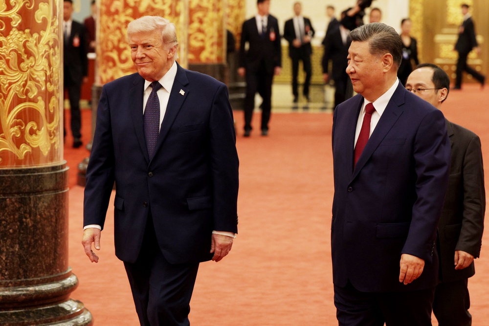 Donald Trump arrives for a state banquet hosted by Xi Jinping at the Great Hall of the People on 14 May 2026 (Getty)