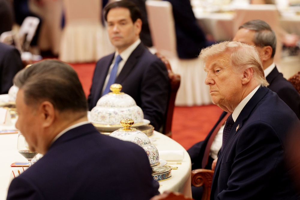 Donald Trump attends a state banquet hosted by Xi Jinping at the Great Hall of the People on 14 May 2026 (Getty)