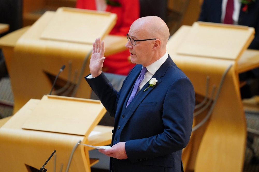As leader of the largest party at Holyrood, John Swinney was the first MSP sworn in on Thursday. (Jane Barlow/PA)