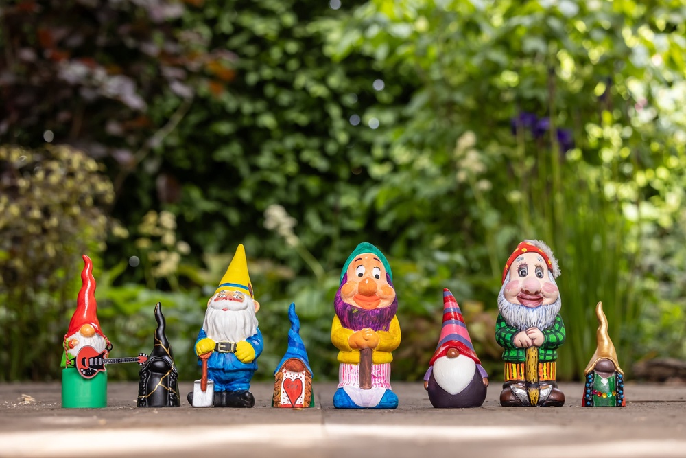 A selection of gnomes painted by celebrities, from left: Sir Brian May, Kelly Hoppen, Alan Titchmarsh, Mary Berry, Frances Tophill, Angellica Bell, Joanna Lumley and Floella Benjamin (PA Media)