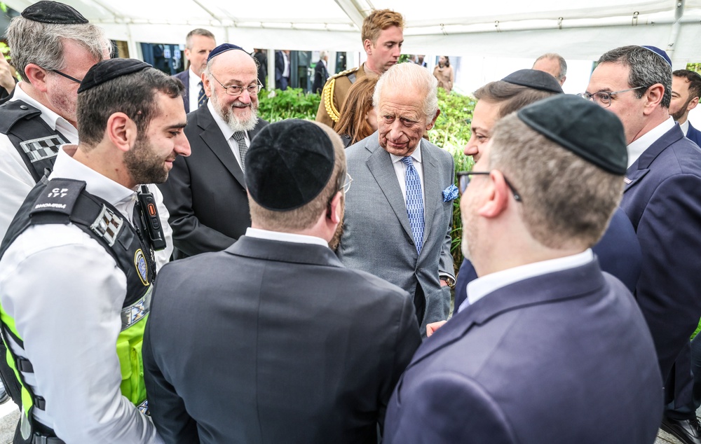 The King, centre, and Chief Rabbi Sir Ephraim Mirvis, centre left, met members of the Shomrin Jewish security organisation (Richard Pohle/The Times/PA) (PA Wire)