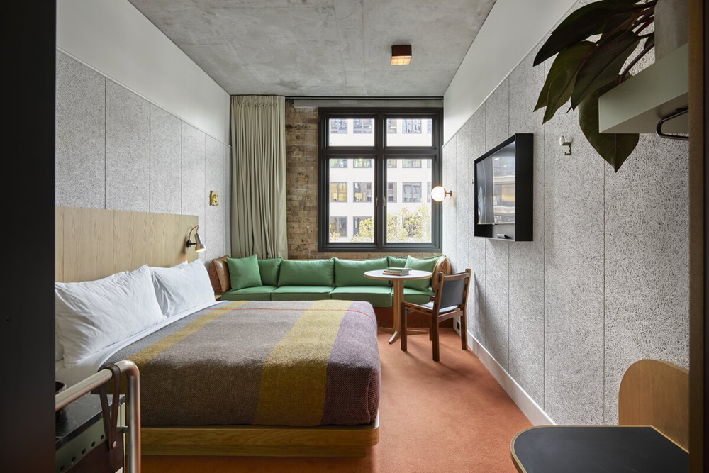 The rooms feature vinyl players and curated records (Ace Hotel)