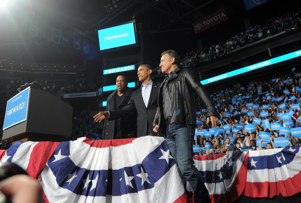 Jay-Z (left) frequently supported former President Barack Obama on his 2012 campaign trail (AFP via Getty Images)