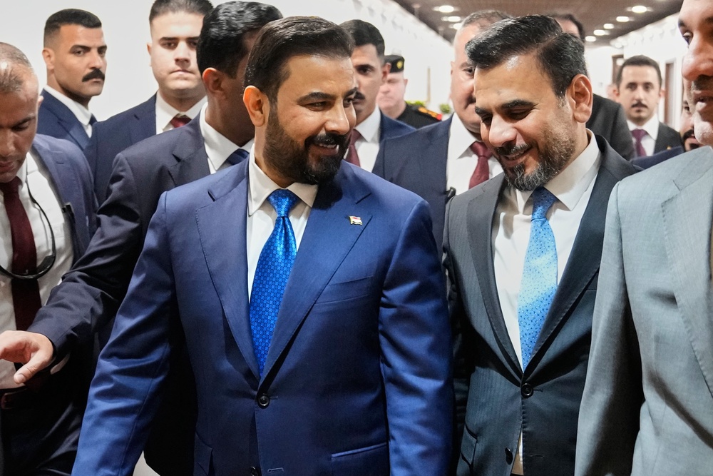 Iraq's Prime Minister-designate Ali al-Zaidi, front left, arrives at the Iraqi parliament to attend the voting of his government in Baghdad, Iraq, Thursday, May 14, 2026. (AP)