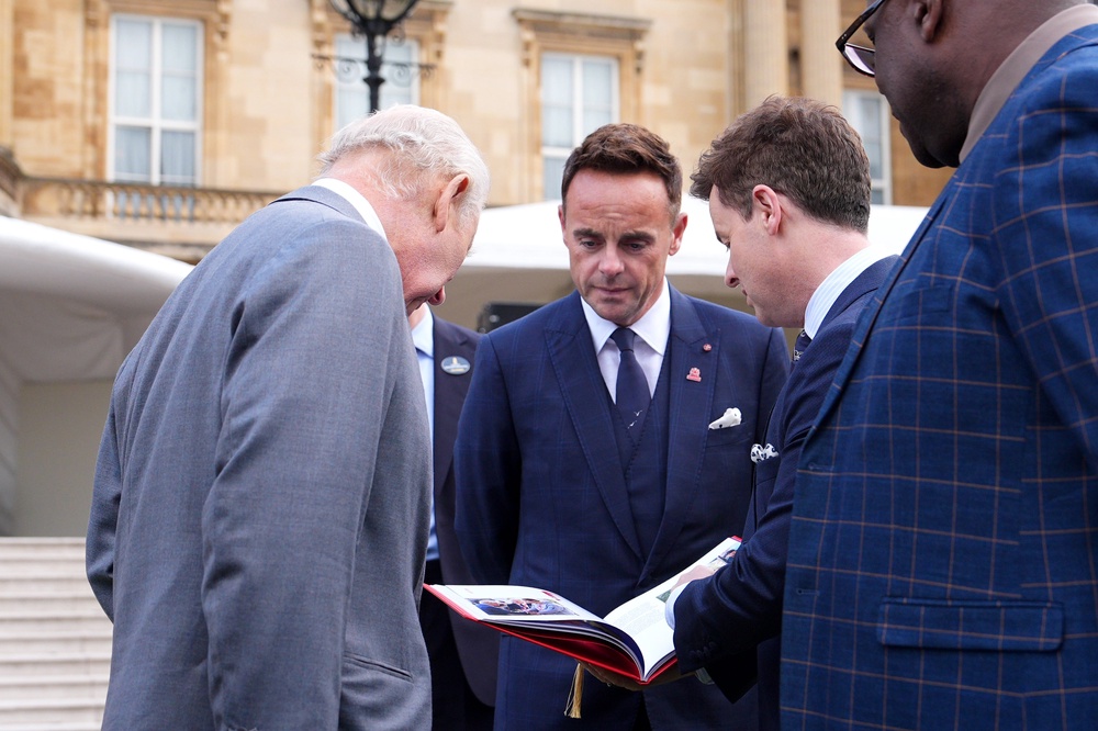 Charles is shown ‘The Year Book’ by Declan Donnelly (Henry Nicholls/PA) (PA Wire)