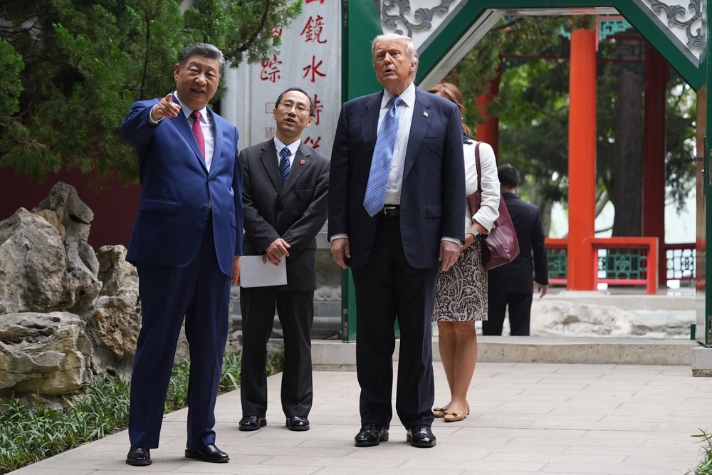 US president Donald Trump and Chinese president Xi Jinping tour the Zhongnanhai leadership compound (Getty)