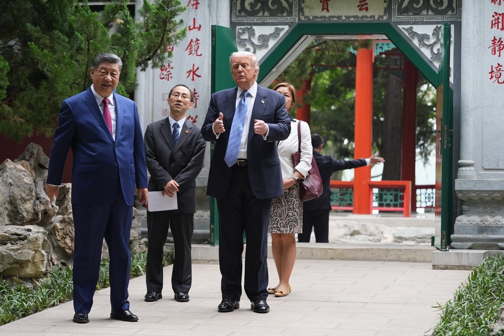 US president Donald Trump and Chinese president Xi Jinping tour the Zhongnanhai leadership compound (Getty)