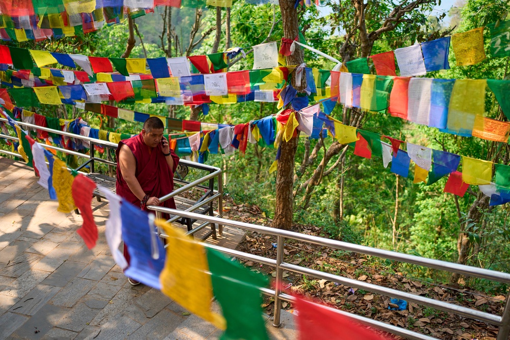 Jalue Dorje speaks on the phone during a visit to Maratika Caves, in eastern Nepal (Copyright 2026 The Associated Press. All rights reserved.)