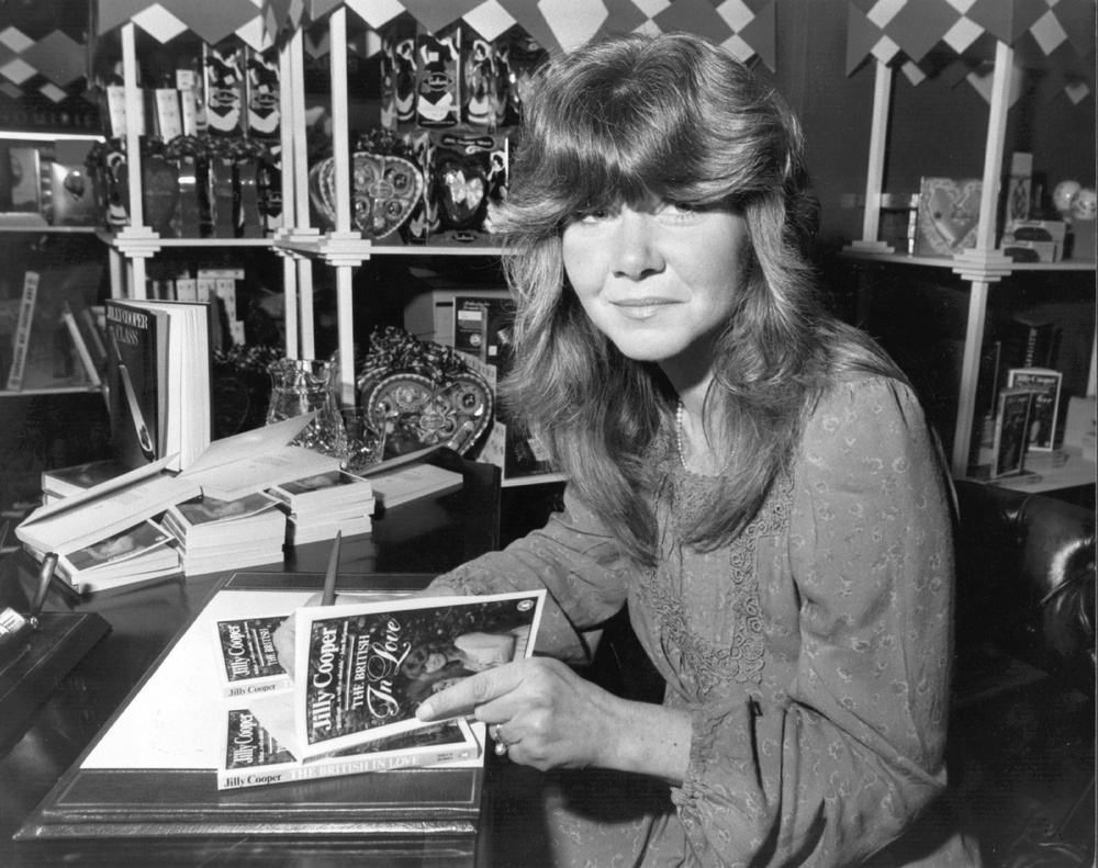Cooper signing copies of her anthology 'The British in Love' at Barkers department store in London (Getty)