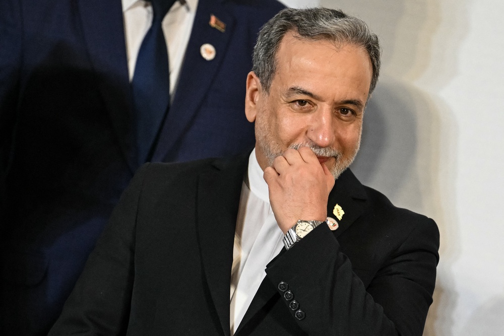 Iran's Foreign Minister Abbas Araghchi gestures as he arrives for a group photograph during the BRICS Foreign Ministers' meeting at the Bharat Mandapam in New Delhi (AFP/Getty)