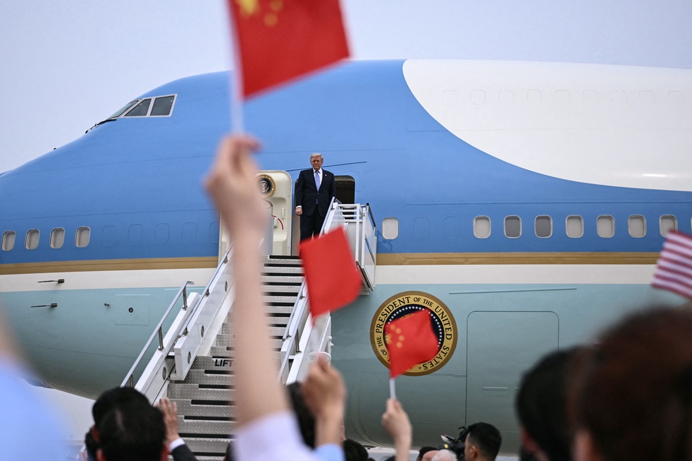 Donald Trump boards Air Force One at Beijing Capital Airport (AFP/Getty)