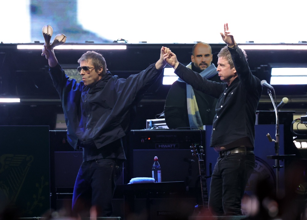Liam Gallagher and Noel Gallagher performing in September (Getty)