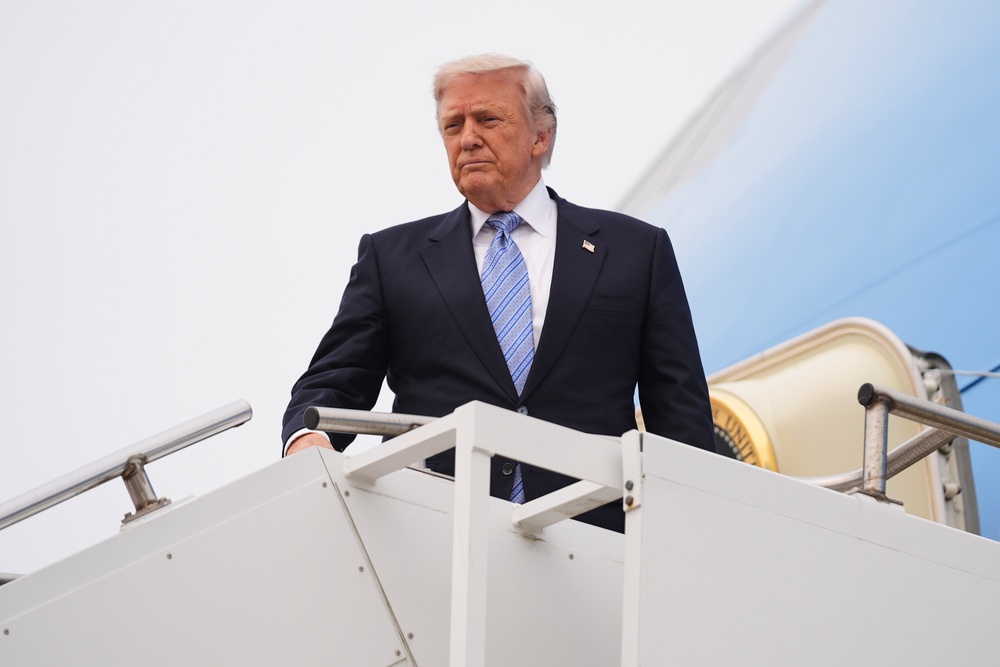 President Donald Trump was speaking from Air Force One as he returned to Washington from China (Mark Schiefelbein/AP) (AP)