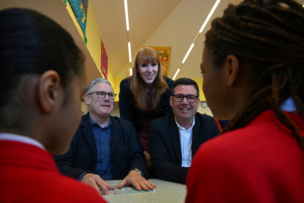 Sir Keir Starmer, Angela Rayner and Andy Burnham during a visit to a school breakfast club in Ashton, Greater Manchester in April (Paul Ellis/PA) (PA Wire)