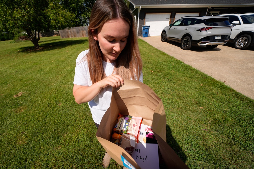 Emily Ingram checks her Walmart order after it was delivered by a drone operated by Zipline in Pea Ridge (Copyright 2025 The Associated Press. All rights reserved)