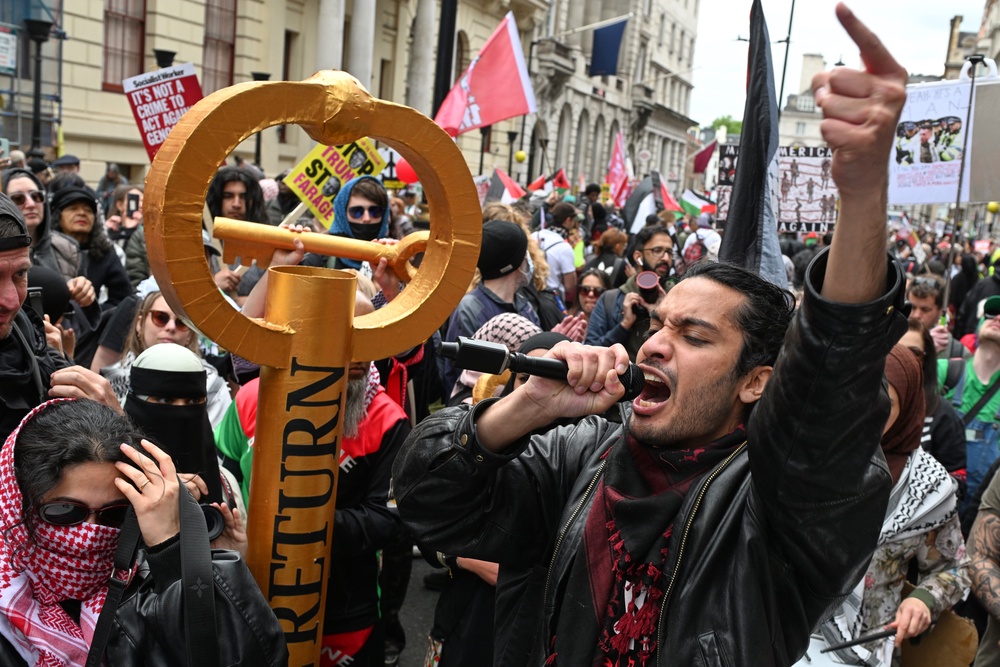 Protesters shout during a Pro-Palestine march in London (AP)